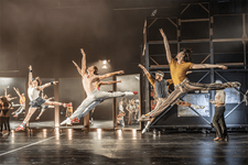 A Chorus Line Production shot. The cast of A Chorus Line jumping simultaneously inarabesque.