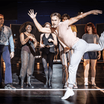 A Chorus Line Production shot. Redmand Rance (Mike Costa) is dancing solo in a way it makes it look like his is runing. The other members of the cast are looking at him, impressed by his dancing.