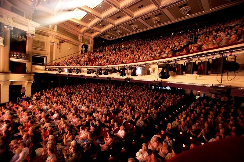 View of a seated audience in the main house.