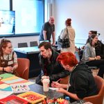 Group of people together in a space doing activities.