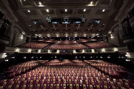 Rows of seats at Birmingham Hippdrome, each with a programme for Hamilton on top of them.